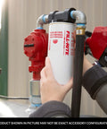 Hands installing Three Quarter Inch Thread Spin On Fuel Filter With Ten Micron Rating For Up To Twenty Five GPM Fuel Transfer Systems