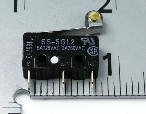 SS5GL2 Micro Limit Switch 125 VAC 5A hinged roller momentary snap action black pack of 5 close-up with ruler for scale