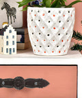 Pink drawer with vintage cast iron drawer pull, antique dresser handle, classic iron furniture hardware in rustic setting