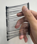 Hand holding a bundle of Premium Heavy Duty Plastic Tagging Fasteners For Retail Apparel Label Guns Hassle Free Price Tag Barbs Bulk Pack Of One Thousand Black Clothing Accessories.