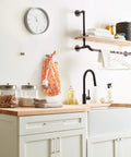 Modern kitchen with Monument Satin Nickel Cabinet Pull, 128 mm center to center, soft brushed finish, on white cabinets.