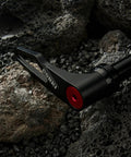 Thru Axle Adapter For Boost Forks, 1.0mm Thread Pitch, black handle on rugged stone background