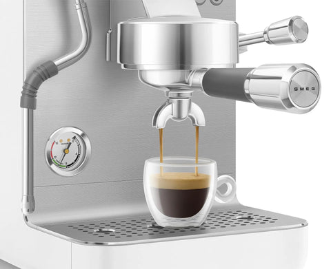 Close-up of the Semi Pro Home Espresso Machine With 15 Bar Pump Triple Thermoblock Heating 58mm Portafilter Steam Wand And Made In Italy Craftsmanship In White making espresso.