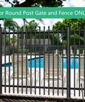 Pool area secured by round post gate and fence with deck chairs and trees in the background