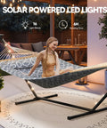 Outdoor Two Person Hammock With Solar Powered Lights And 12 Ft Stand Included Double Hammock shown with woman relaxing on patio
