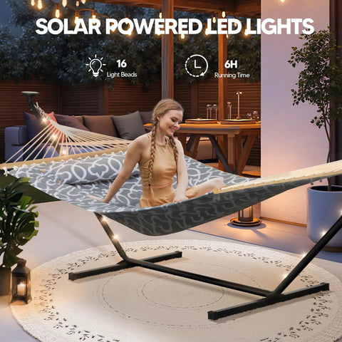 Outdoor Two Person Hammock With Solar Powered Lights And 12 Ft Stand Included Double Hammock shown with woman relaxing on patio