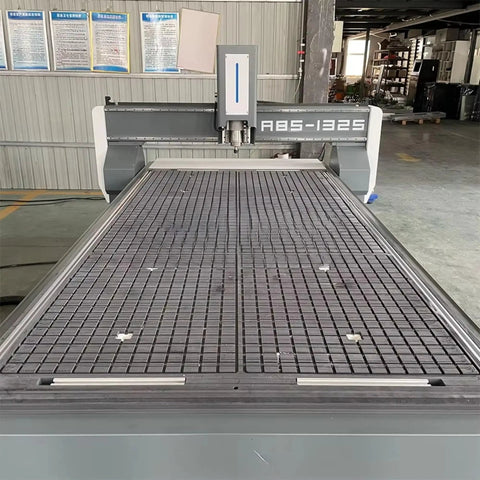 Beefy Heavy Duty Tank Grade CNC Wood Router 1325 4x8 for engraving, showing large workbed in an industrial woodshop