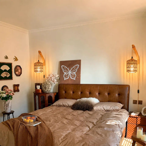 EHFMGYB Rattan Wall Sconces Set of Two Plug in, Boho Wall Lamp with 9.84FT Plug in Cord beside a cozy bed in a stylish bedroom.
