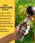 Hand holding Pro Grade Heat Index Monitor With Wet Bulb Globe Temperature Gauge And Brass Ball showing 26.3°C.