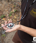 Person holding TruArc10 Baseplate Compass for Weekend Camping with Reversible Slide Scale and Magnified Readout