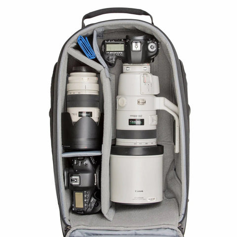 Open Streetwalker Rolling Camera Backpack With Dedicated Laptop Pocket And Minimalist Black Exterior showing organized camera gear