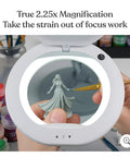 Hands Free LED Magnifying Glass With Adjustable Stand And Floor Lamp, XL Magnifier Lens On 5 Foot Reach showing mini painting.