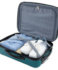 Travelers Club Chicago hardside expandable spinner luggage, teal, 22-inch carry-on, open with clothes and sneakers