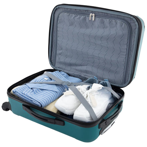Travelers Club Chicago hardside expandable spinner luggage, teal, 22-inch carry-on, open with clothes and sneakers