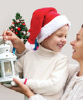 Child holding lantern with 24 Pack Battery Operated Tea Lights Candles With Realistic LED Flicker, mother in holiday hats, decorated tree