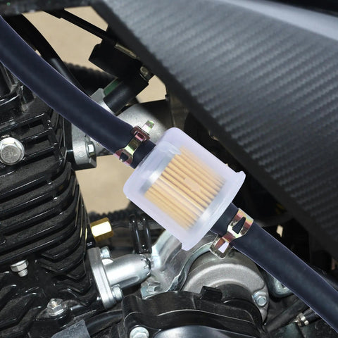 Close-up of a Replacement Gas Inline Fuel Filter for Three Eighth Inch Fuel Lines connected to a motorcycle engine.