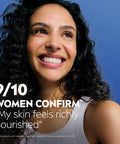 Happy woman with glowing skin smiling, highlighting satisfaction with Game Changer Cocoa Butter Body Lotion For Crispy Dry Skin With Hyaluronic Acid And 72 Hour Deep Hydration To Melt Away Flakiness Reveal A Natural Glow And Leave Your Complexion Feeling Like Velvet All Day Long In A 16 9 Oz Tube.