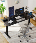 Huanuo 70x35 Inch Electric Standing Desk With Three Stage Brushless Motor Black, dual monitors and laptop setup for productivity.