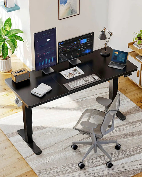 Huanuo 70x35 Inch Electric Standing Desk With Three Stage Brushless Motor Black, dual monitors and laptop setup for productivity.