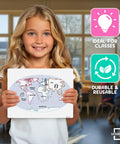Girl holding Continents Map Practice Sheets 9x12 Dry Erase World Globe Sheets Pack of 10 for Homeschool and Classroom