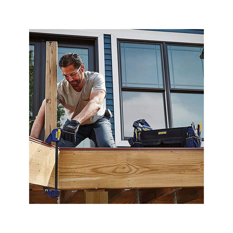 Person using One-Handed Quick-Change Bar Clamp For Medium-Duty Projects, 12 Inch, 300 Lbs Clamping Pressure on wood structure.