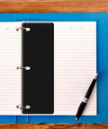 Sheet Lifters For 3 Ring Binders 11 By 3 Inches Protect Hole Edges And Prevent Tearing With Easy Flow Design next to pen on notebook