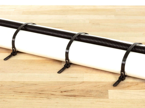 Heavy Duty Reusable Cable Zip Ties Set securing cables on a wooden surface
