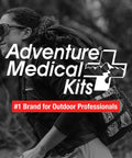 Adventure Medical Kits Ultralight/Watertight Medical Kit logo visible with hiker wearing backpack outdoors