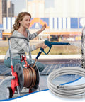 Garden hose with stainless-steel braided body and blue spray nozzle; 5 ft length, 5/8 in ID, coiled on outdoor reel