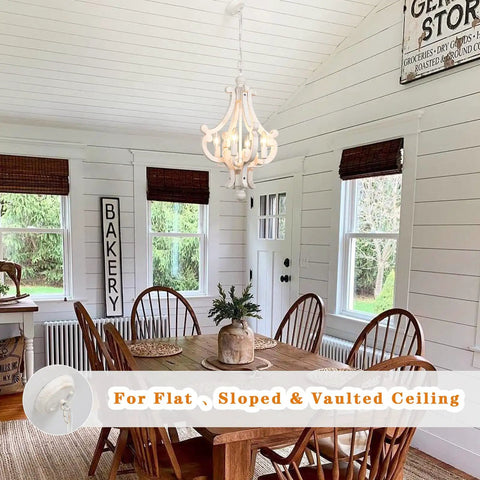 Farmhouse Rustic Wooden Chandelier With Four Lights In Antique White Finish For Dining Room Kitchen Island And Living Areas Adjustable Height Hanging Chain From 27 To 86 Inches Delivers Cozy French Country Vibe installed in dining room with wooden table and chairs.