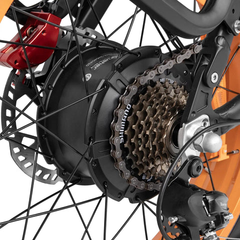 Close-up of the rear hub motor and gears of the Blue Fat Tire Electric Bike For Epic Mountain Trails And Smooth City Cruising.