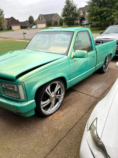 Rich Jade Green Basecoat Paint Gallon Drop In Ready To Spray applied on this pickup truck with chrome rims in suburban setting.