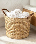 Large Water Hyacinth Storage Basket 15.7 Inch Woven Seagrass Bin With Sturdy Design and rolled towels in bathroom setting