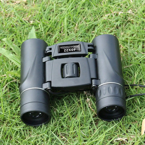 Compact Folding Binoculars 40X22 Dope Clarity With Bak4 FMC Optics, 2000M Long Range for Hunting placed on grass