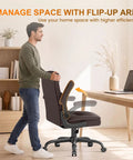 Premium Mid Back Leather Executive Office Chair Featuring Ergonomic Lumbar Support And Flip Up Armrests For Boss Level Comfort During Long Study Marathons And Crunch Time Deadlines, shown with flip-up arms, in a home office.