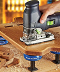 Hand using a router on wood supported by XL Risers For Bench Cookie Plus And Connect Work Grippers, Heavy Duty Woodworking Upgrade For Clearance And Lateral Stability, Height Up To 5 Inches, Wood Riser With Threaded Stud, 4 Pack.