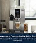 One Touch Espresso Machine With Automatic Milk Frother And Built In Grinder For Barista Level Lattes And Cappuccinos Dead Simple Top Shelf Silver Kitchen Setup next to frothy coffee drinks and jars.