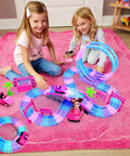 Two girls playing with Pink 177 Piece Flexible Track Car Toy Set For Girls Ages 3 4 5 6 With 360 Degree Rotating Tracks Princess Car