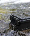 All Weather Waterproof Camera Case With Foam For Drones And Gear Grab And Go Bombproof Protection in black on wet rocks