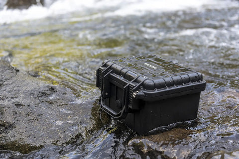 All Weather Waterproof Camera Case With Foam For Drones And Gear Grab And Go Bombproof Protection in black on wet rocks