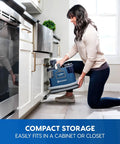 Person storing Portable Carpet And Upholstery Spot Cleaner With SixFoot Hose For Deep Stain Busting On Carpets Rugs Furniture And Auto Interiors Lightweight Design For Easy Lifts And Quick Cleanup.