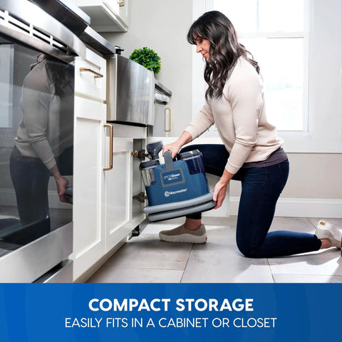 Person storing Portable Carpet And Upholstery Spot Cleaner With SixFoot Hose For Deep Stain Busting On Carpets Rugs Furniture And Auto Interiors Lightweight Design For Easy Lifts And Quick Cleanup.