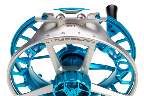 Front view of Litespeed M Fly Reel for saltwater big game ultramarine finish ultra lightweight CNC machined frame super large arbor.