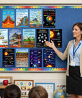 Teacher presenting Earth Science Poster Set For Classrooms 13 Topics 11x17 Learning Charts on classroom wall.