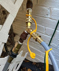 3/8 inch brass Y splitter connecting propane hoses to a gas line. Gas Y Splitter For Propane Hoses With Brass 2 Way Tee Quick Connect Adapters And Shut Off Valve Conversion Kit For Easy Hookup To Hose Tank Line Fits Pizza Ovens Grills Generators And Patio Heaters Three Eighths Inch.