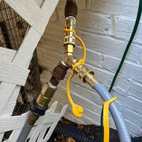 3/8 inch brass Y splitter connecting propane hoses to a gas line. Gas Y Splitter For Propane Hoses With Brass 2 Way Tee Quick Connect Adapters And Shut Off Valve Conversion Kit For Easy Hookup To Hose Tank Line Fits Pizza Ovens Grills Generators And Patio Heaters Three Eighths Inch.