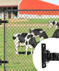 Built Like A Tank Heavy Duty Gate Hinges With Secure Removable Bolt System on a chain link fence with cows in the background.