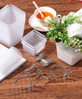 12 Pcs Pegboard Bins And Cups With Hooks And Loops Pegboard Basket Set arranged on a wooden table with flowers