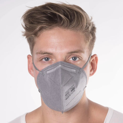 Man wearing N95 Disposable Respirator Mask Made In USA Super Comfy Fit Breathable Skin Friendly Nonwoven Fabric NIOSH Approved