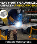 Heavy Duty Foldable Work Platform And Rolling Welding Station With Rock Solid 1200 Pound Capacity Adjusts 29 To 48 Inches High Perfect Garage Workhorse For Paint Jobs And Hella No Sweat Diy Setup. Worker welding on galvanized surface.